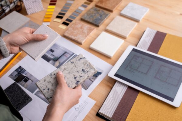 designer with material samples and ipad